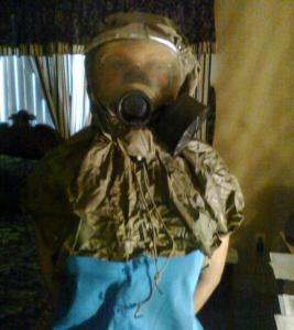 Gretchen Molannen in a gas mask prior to committing suicide after being denied Social Security disability